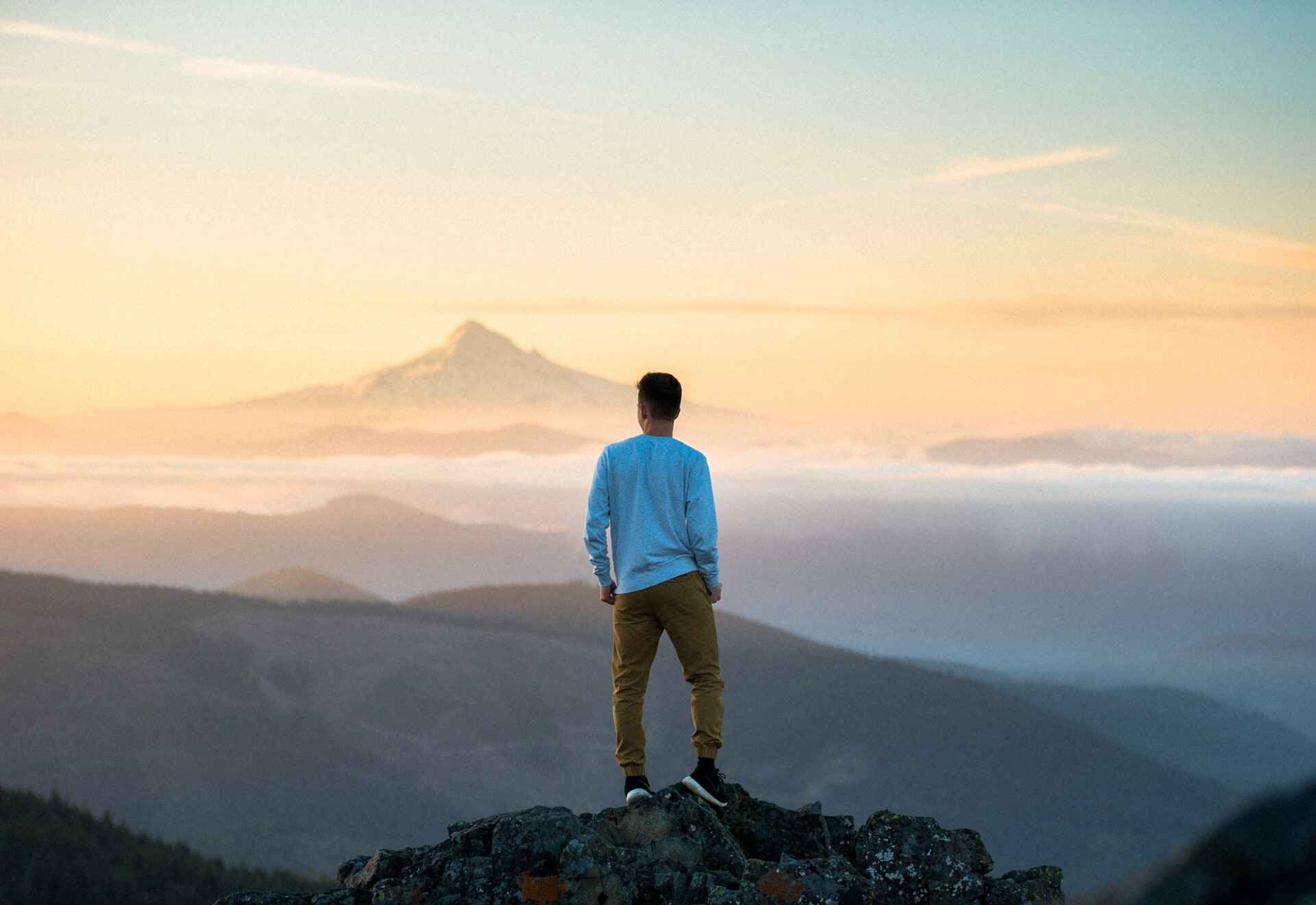 Man on top of mountain